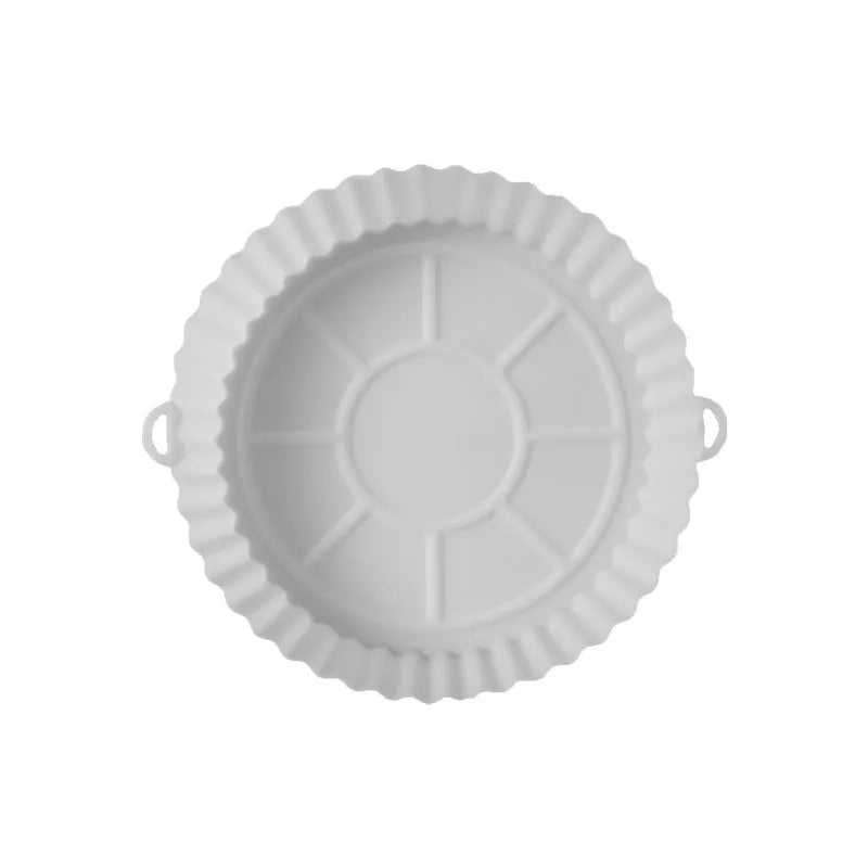 Round blue silicone baking tray mat with 4.5cm sides on a kitchen counter.
