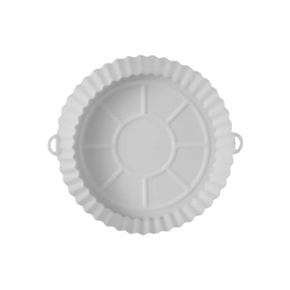 Round blue silicone baking tray mat with 4.5cm sides on a kitchen counter.