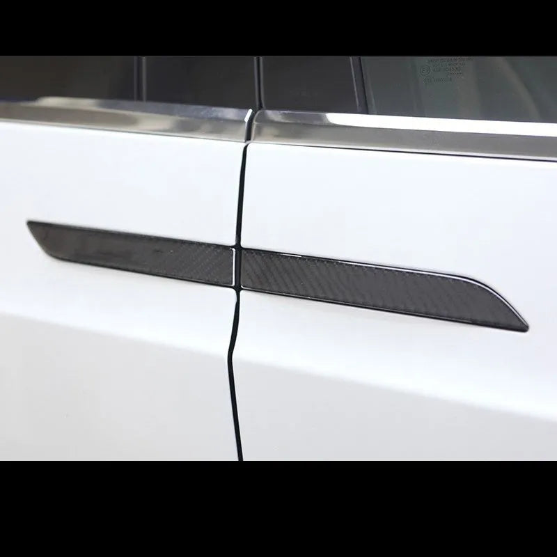 Set of four carbon fibre texture adhesive door handle protectors for Tesla Model S interior.