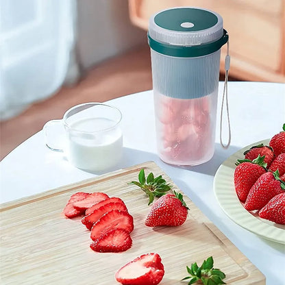 Multi-function portable blender in blue, green, or pink with USB cable and detachable parts for juicing