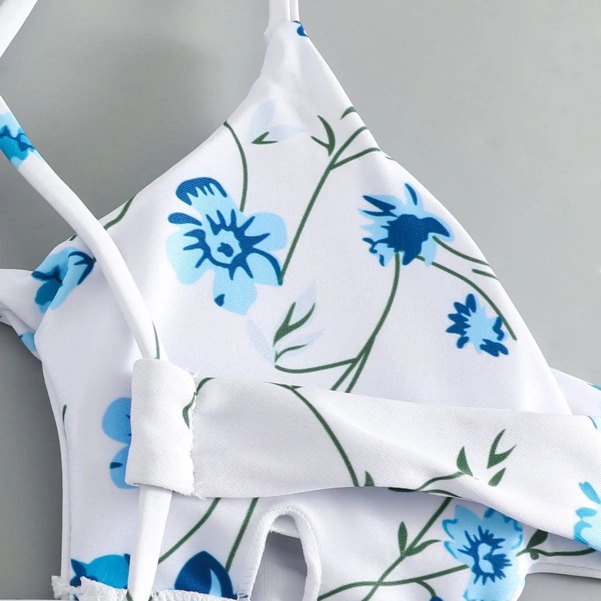 Floral tie-neck triangle bikini top with matching ruffle shorts swimsuit set