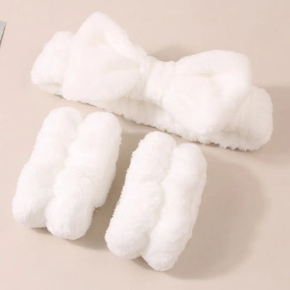 Facial brush set with coral fleece hair band and four nylon-bristle brushes in purple, grey, white, or pink colours