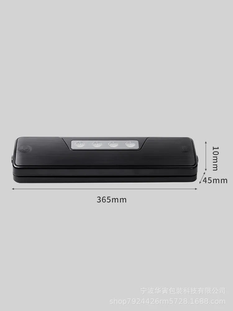 Black automatic vacuum sealer with 30cm sealing bar on kitchen counter next to vacuum-sealed food packages
