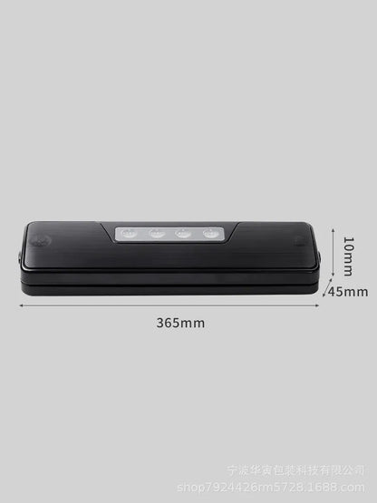 Black automatic vacuum sealer with 30cm sealing bar on kitchen counter next to vacuum-sealed food packages