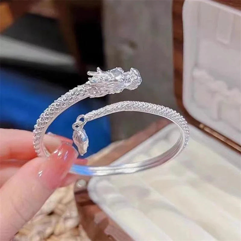 Adjustable Chinese dragon tail bangle with intricate relief design
