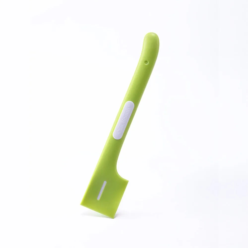Green long-handle pet feeding spoon with right-angle head for scraping canned wet food.