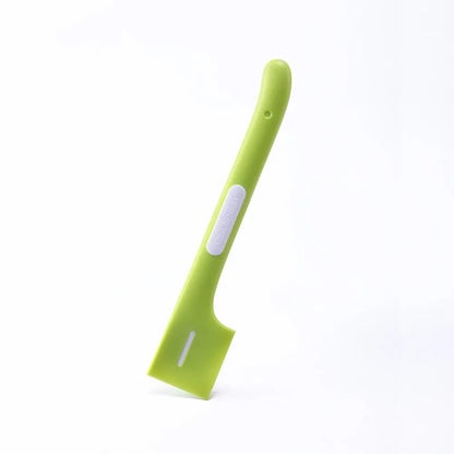 Green long-handle pet feeding spoon with right-angle head for scraping canned wet food.