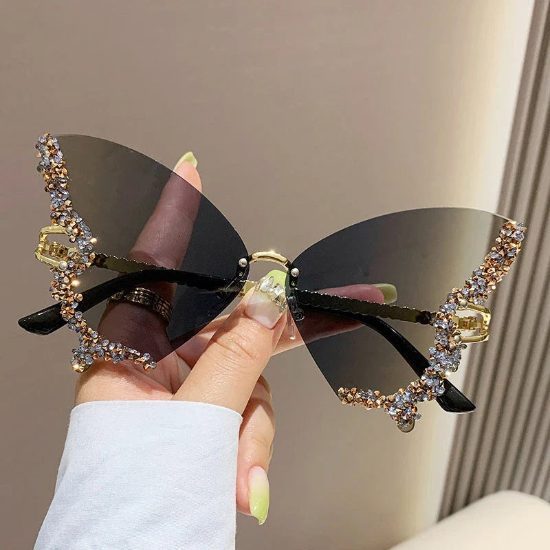 Chic butterfly-shaped sunglasses with diamond accents in various gradient color options