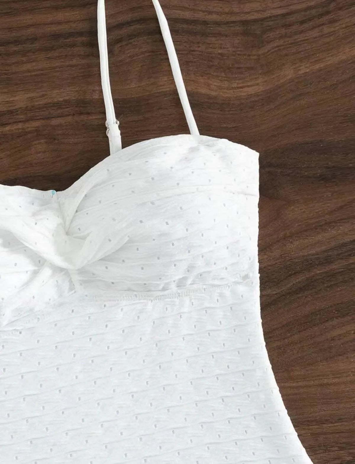 White one-piece swimsuit for women with sling design made from quick-drying polyester fabric