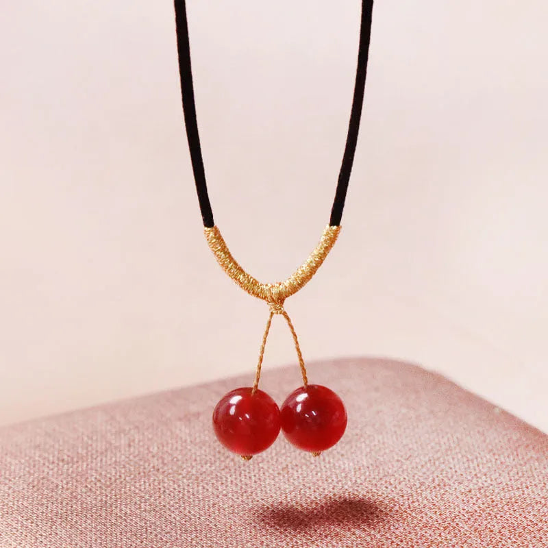 Hand-woven red agate bracelet and necklace set for women in national style with bead design.