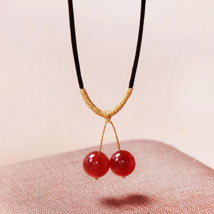 Hand-woven red agate bracelet and necklace set for women in national style with bead design.