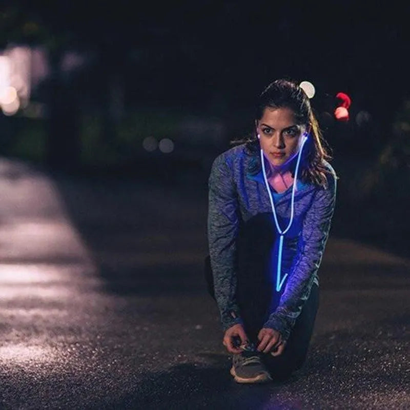 Magic Light LED Earphones in blue, green, or pink with aluminium alloy shells and EL light lines syncing to music rhythm.