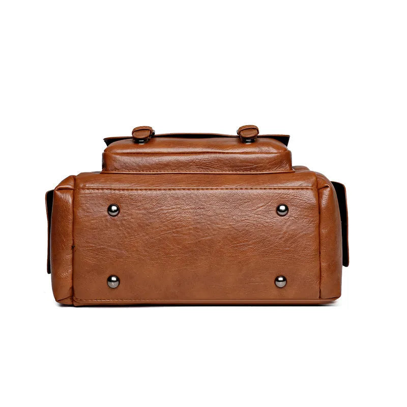 Vintage style messenger bag in PU leather with contrast stitching, horizontal square shape, shown in multiple colour options