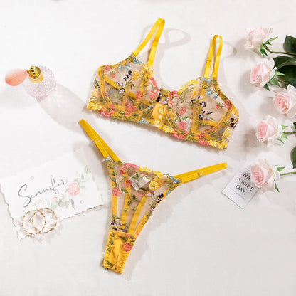 Floral mesh bra and T-back underwear set in skin colour on a mannequin