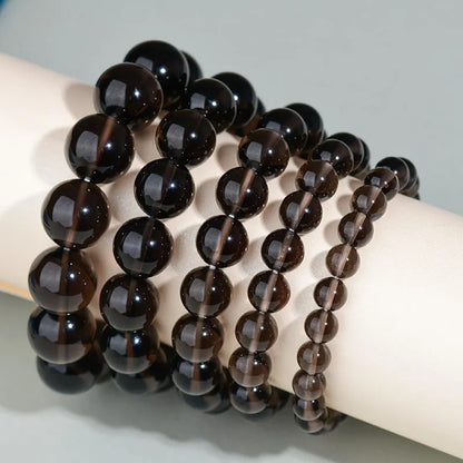 Hand-woven obsidian crystal bracelet showing round beads with ethnic styling in multiple colour options