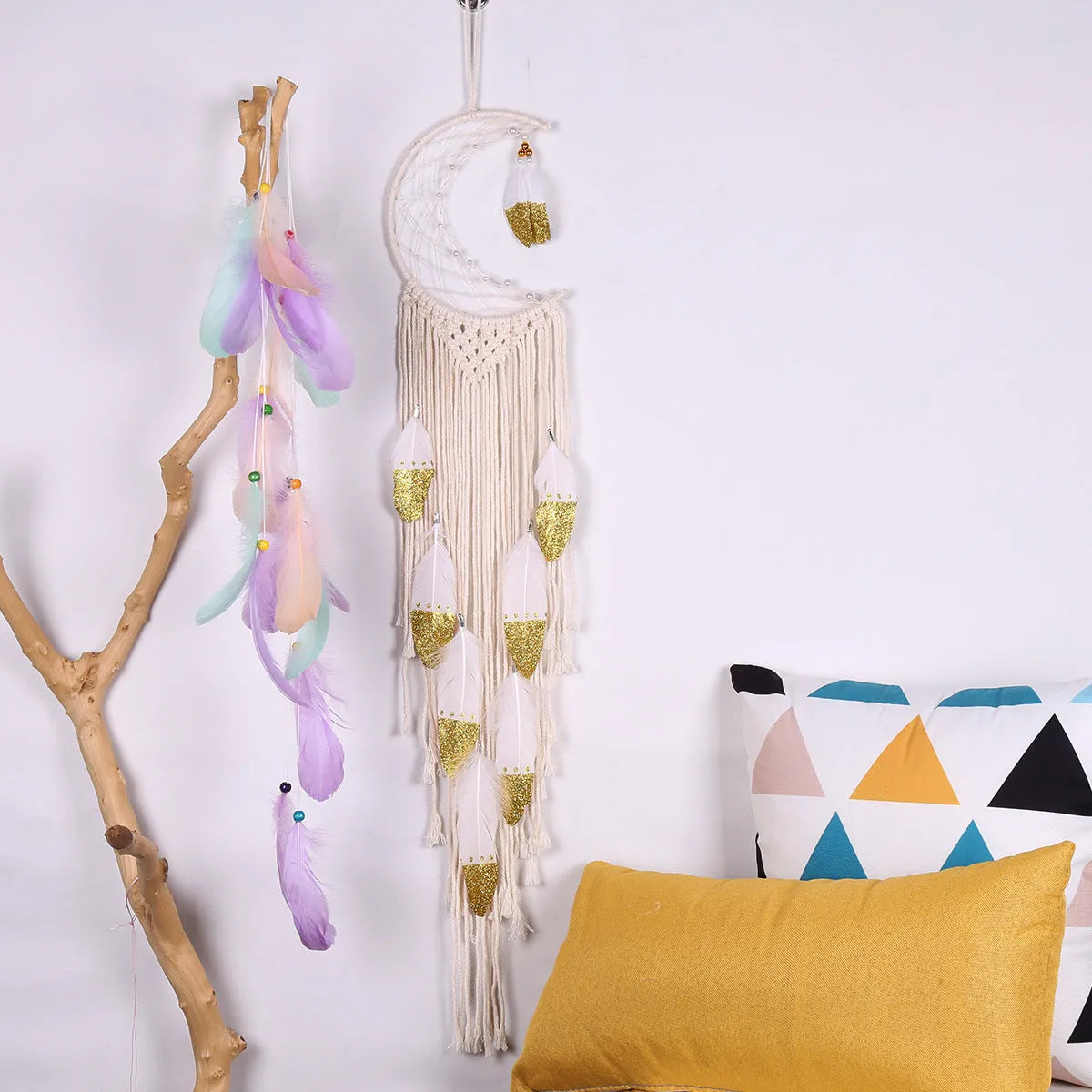 Gold crescent dream catcher wall decoration made from woven cotton thread, 20cm wide by 100cm high.