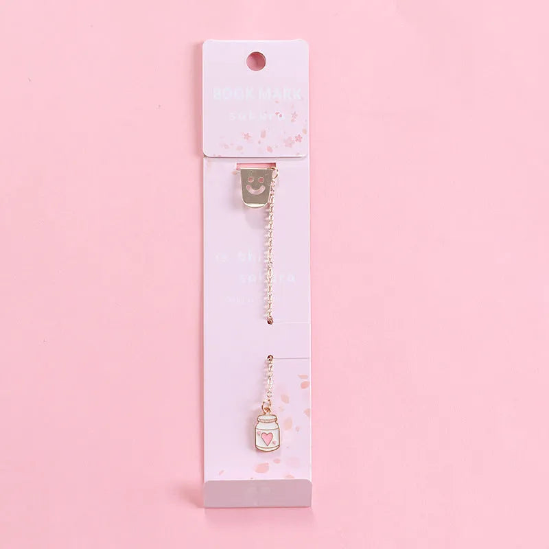 Alloy metal cartoon pendant bookmark with colourful charms including panda, rocket, and wishing bottle designs