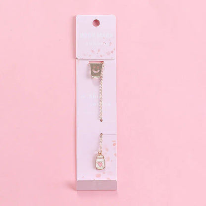 Alloy metal cartoon pendant bookmark with colourful charms including panda, rocket, and wishing bottle designs