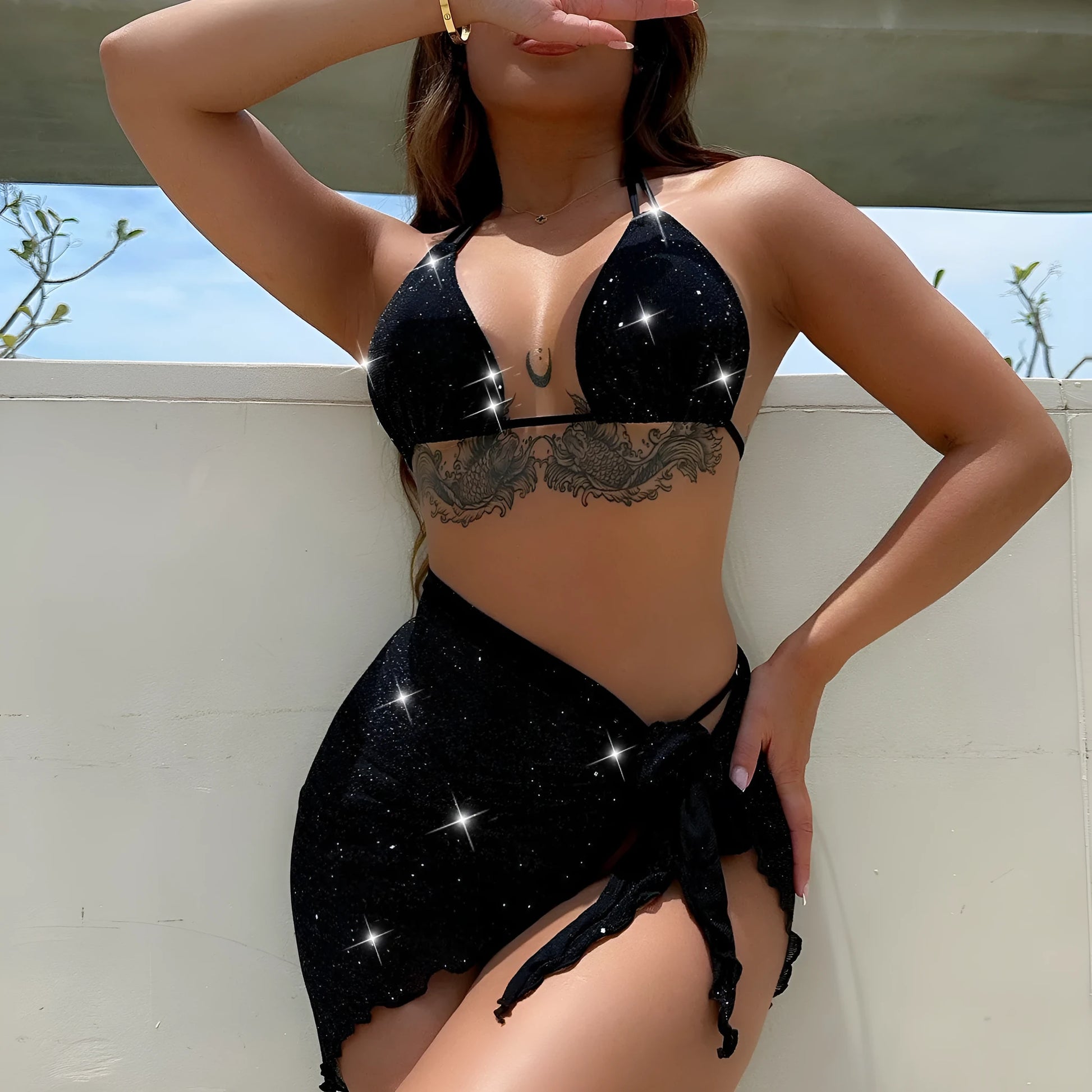 Black three-piece fission style swimsuit bikini set with top and shorts on a mannequin.