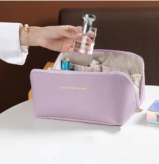 Premium PU leather cosmetic bag with large capacity, versatile storage, and water-resistant design for modern women on the go