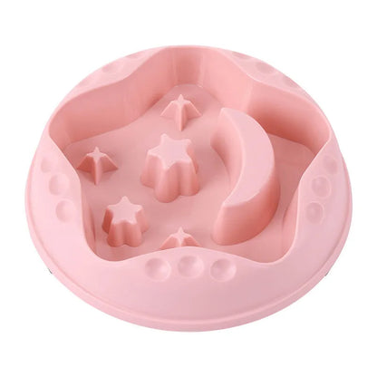 Blue slow feeder dog bowl with raised moon and star patterns inside, non-slip base