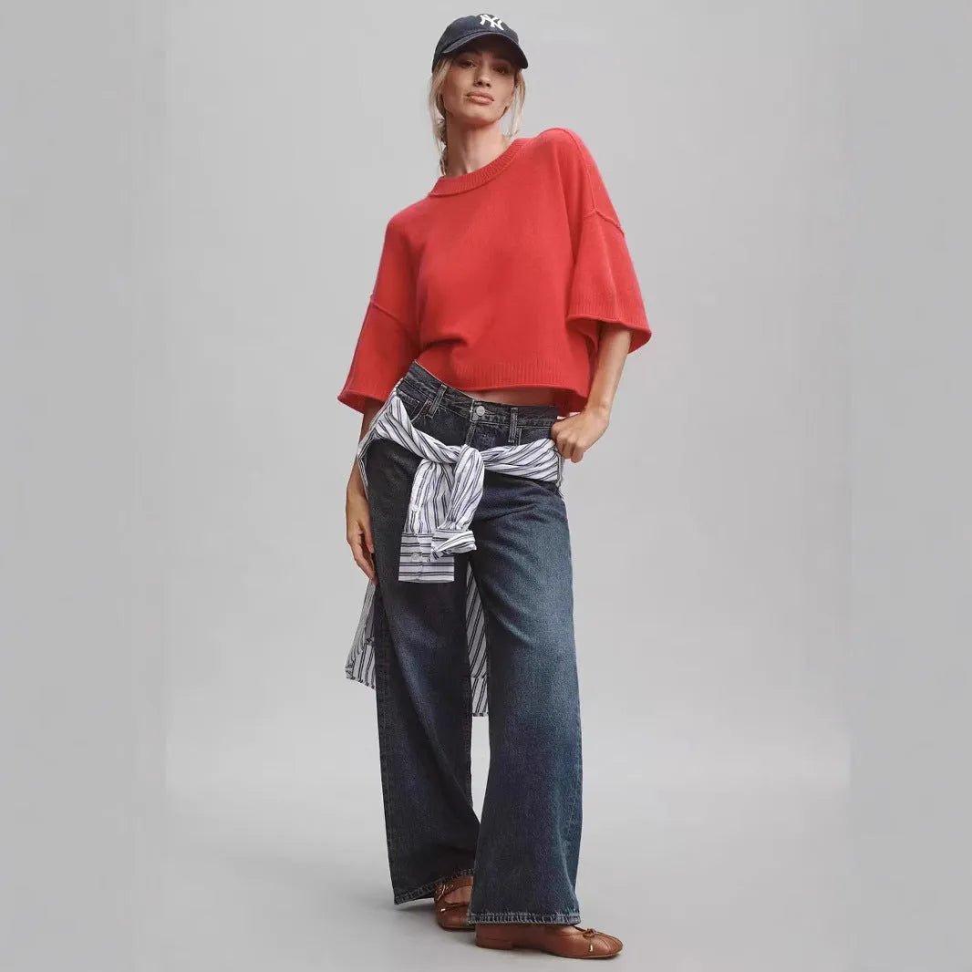 Women's red short sleeve viscose T-shirt with an exposed navel cropped design on a model.