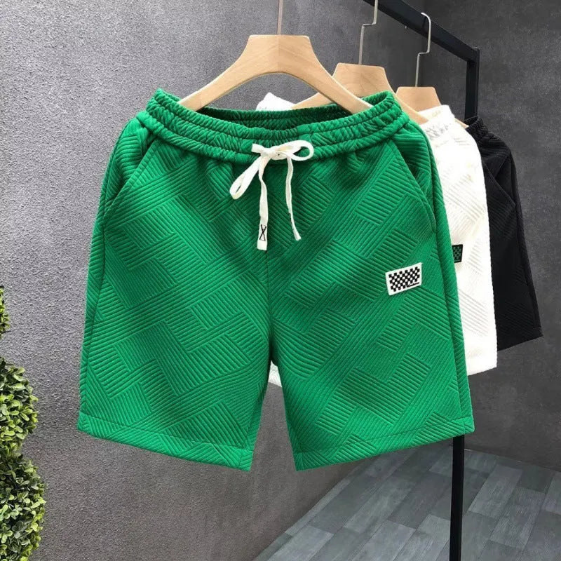 Men's solid colour polyester sports shorts with micro-elasticity, shown in black.
