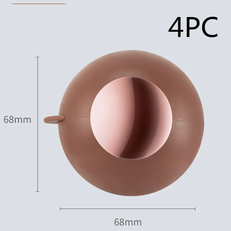 Reusable gel lint roller ball in green gold colour for removing pet hair and lint from fabrics.