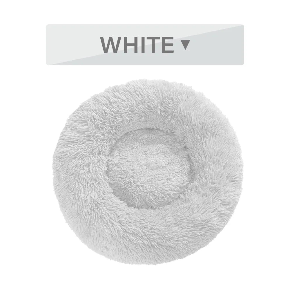 Fluffy donut-shaped pet bed with raised bolster edge in long plush material