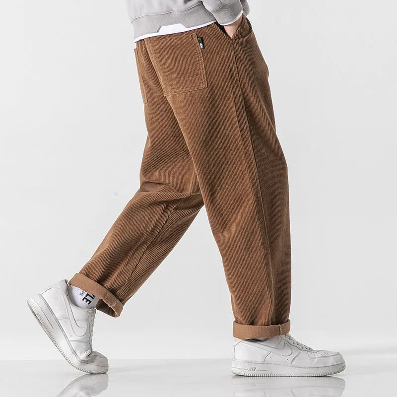 Men's loose fit corduroy sports trousers in Army Green colour with straight leg design and elasticated waist