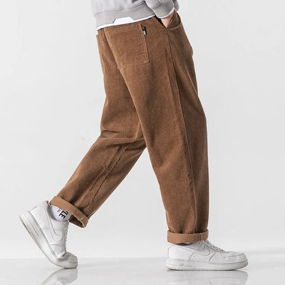 Men's loose fit corduroy sports trousers in Army Green colour with straight leg design and elasticated waist