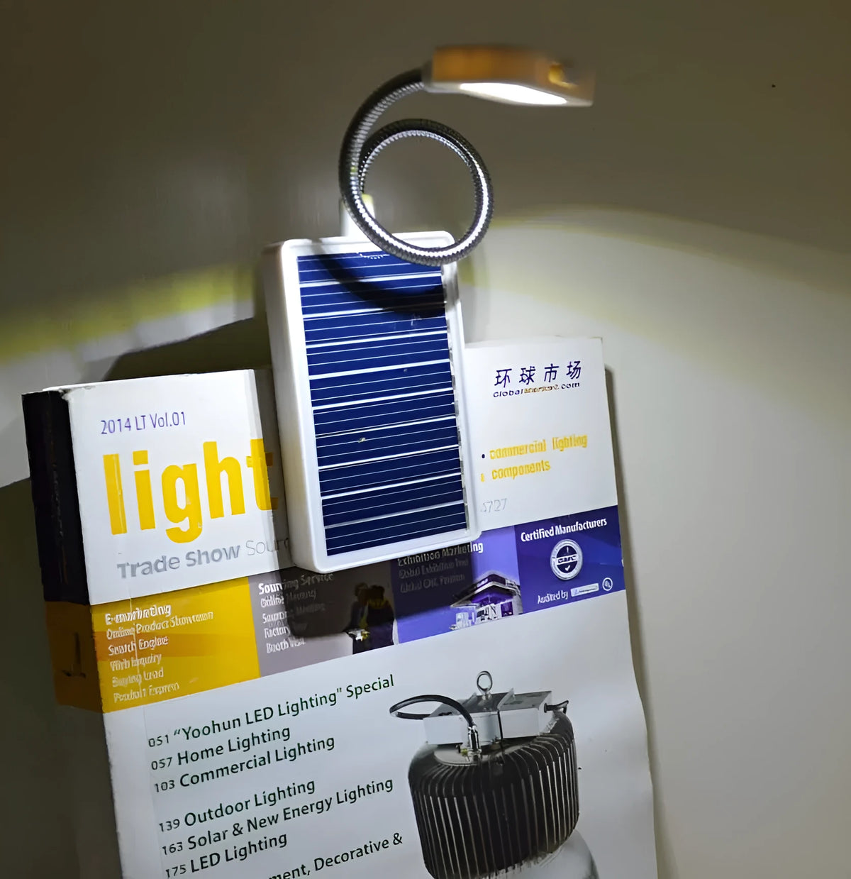 Solar-powered LED garden light with plastic lampshade and button switch for outdoor illumination