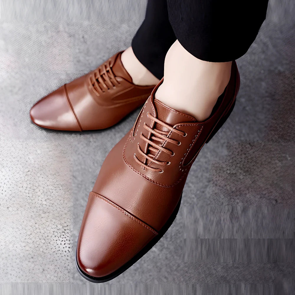 Men's black casual leather shoes with low-top design and visible sewing lines on PU leather upper