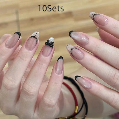 Five packs of reusable coloured false fingernails with various designs.