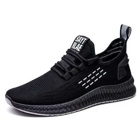Men's black casual sports shoes with cross-strap detail and a Flying Weave upper, shown on a white background.