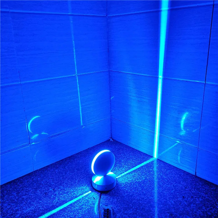 Aluminium LED spotlight bar wall lamp with glass lens, shown in a corridor setting.