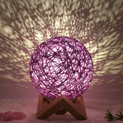 LED rattan table lamp with hand-knit linen shade in various colours