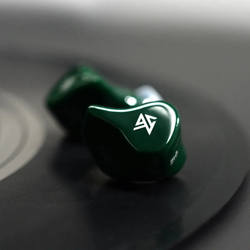 Z1 black and green true wireless Bluetooth in-ear headphones showing separate earpieces