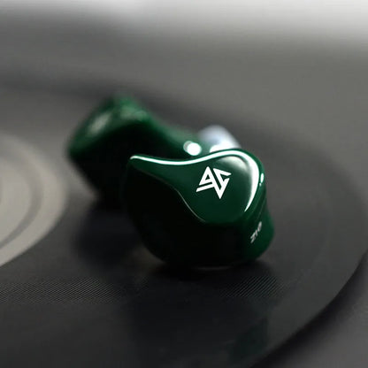 Z1 black and green true wireless Bluetooth in-ear headphones showing separate earpieces
