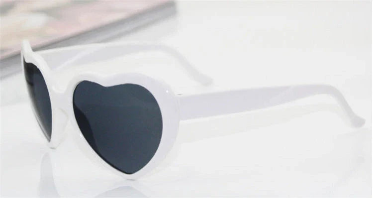 Fashionable heart-shaped light-up glasses with a built-in LED lighting system, perfect for adding a touch of love and playfulness to any occasion.