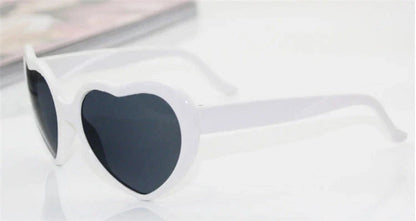 Fashionable heart-shaped light-up glasses with a built-in LED lighting system, perfect for adding a touch of love and playfulness to any occasion.