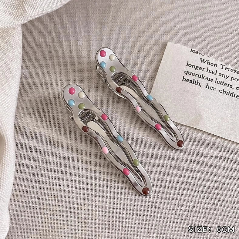 Silver metal hair barrettes with hollow heart pattern and duckbill clip design