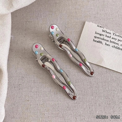 Silver metal hair barrettes with hollow heart pattern and duckbill clip design