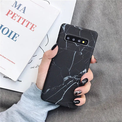 Samsung phone case with white and grey marble pattern on a polycarbonate back cover.