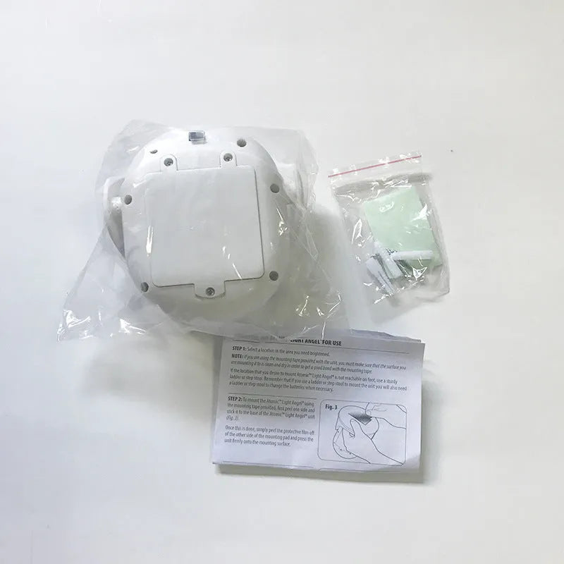 White angel design induction night light on table showing dimensions