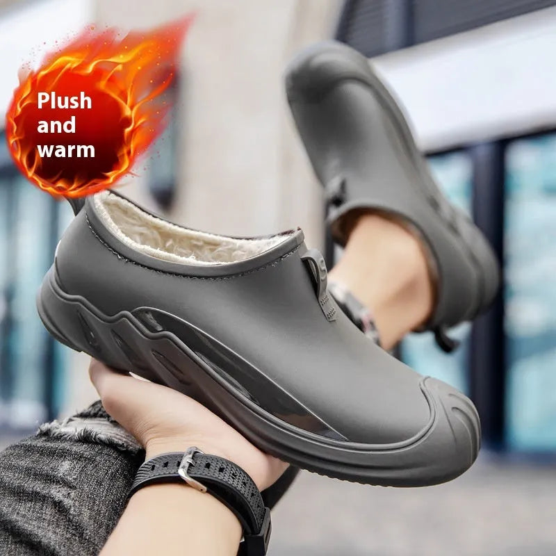 Men's short casual rain boot in solid colour, plastic upper, shown on foot.
