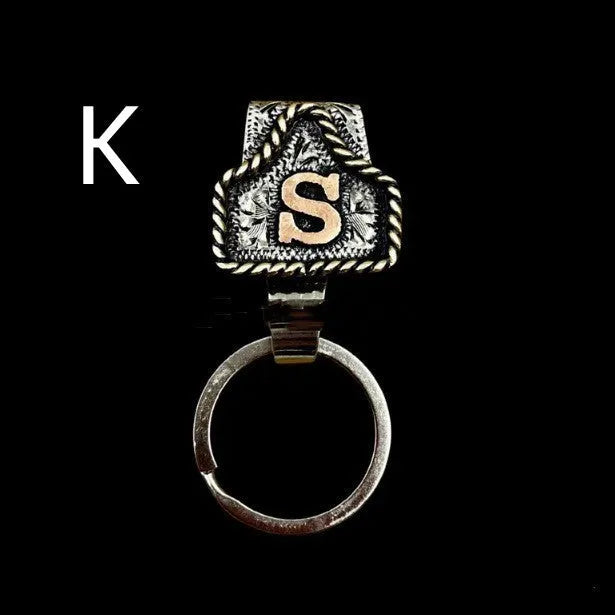 Handmade cow tag design metal keychain on a keyring, shown in one of many available colours.