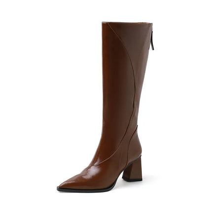 Women's black retro high heel riding boots with a waterproof platform and cowhide upper.