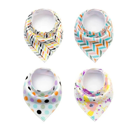 Set of four cotton baby bibs with arrow and wave designs for mess-free feeding