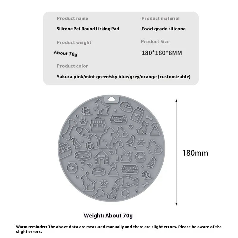 Round blue silicone pet licking mat with textured surface and a clear central suction cup, shown on a tile floor.